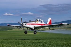 aircraft spraying crops with pesticides.